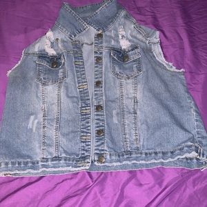 Mid length, sleeveless, jean jacket